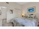 Bedroom featuring a bed, closet, light fixture, and a picture at 5632 Ashton Lake Dr # 5632, Sarasota, FL 34231
