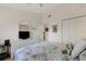 Bright bedroom featuring a bed, closet, mirror, and a ceiling fan at 5632 Ashton Lake Dr # 5632, Sarasota, FL 34231