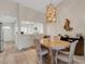 Dining room view showcasing the kitchen area and light-filled interiors at 5632 Ashton Lake Dr # 5632, Sarasota, FL 34231