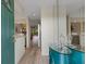 Bright entryway with a modern console table and mirror, leading into the kitchen and living area at 5632 Ashton Lake Dr # 5632, Sarasota, FL 34231