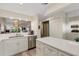 Well-lit kitchen with stainless steel appliances and open layout to the living room at 5632 Ashton Lake Dr # 5632, Sarasota, FL 34231