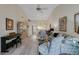 Spacious living room featuring modern flooring, elegant decor, and access to dining area at 5632 Ashton Lake Dr # 5632, Sarasota, FL 34231