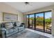 Comfortable living area with plush seating and sliding glass doors that open to a private deck at 5632 Ashton Lake Dr # 5632, Sarasota, FL 34231