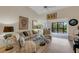 Airy living room with a cozy seating arrangement and sliding doors to a private outdoor deck at 5632 Ashton Lake Dr # 5632, Sarasota, FL 34231