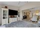 Bright living room with open layout flowing seamlessly to dining and a glimpse of a piano at 5632 Ashton Lake Dr # 5632, Sarasota, FL 34231
