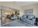 Bright living room with wood floors, comfortable seating, and open floor plan at 5632 Ashton Lake Dr # 5632, Sarasota, FL 34231