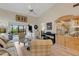 Bright living room with vaulted ceiling, sliding glass doors, and stylish furnishings at 5632 Ashton Lake Dr # 5632, Sarasota, FL 34231