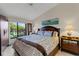 Comfortable main bedroom with king bed and outside view at 5632 Ashton Lake Dr # 5632, Sarasota, FL 34231