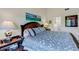 Comfortable main bedroom featuring a king size bed and side tables at 5632 Ashton Lake Dr # 5632, Sarasota, FL 34231