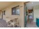 Charming patio with table and chairs, adjacent to the unit's entrance, offering a cozy outdoor space at 5632 Ashton Lake Dr # 5632, Sarasota, FL 34231