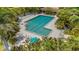 A stunning aerial view of a community pool surrounded by lush landscaping at 5632 Ashton Lake Dr # 5632, Sarasota, FL 34231