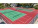 Overhead view of tennis courts with green and red surfaces at 5632 Ashton Lake Dr # 5632, Sarasota, FL 34231