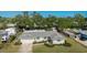 Aerial view of a single-Gathering home with a green roof and front-facing garage at 5706 10Th Avenue Dr W, Bradenton, FL 34209