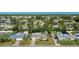 Home with a lush, green lawn and mature trees, showcased from an aerial perspective at 5706 10Th Avenue Dr W, Bradenton, FL 34209