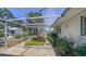 This is a view of a serene backyard oasis featuring a charming water feature and lush landscaping at 5706 10Th Avenue Dr W, Bradenton, FL 34209