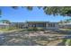 Charming backyard featuring a large screened-in patio, lush landscaping, and a tranquil setting at 5706 10Th Avenue Dr W, Bradenton, FL 34209