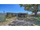 Spacious backyard with screened-in patio and lush, mature landscaping at 5706 10Th Avenue Dr W, Bradenton, FL 34209
