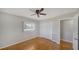 Cozy bedroom featuring a ceiling fan, hardwood floors, and a double closet at 5706 10Th Avenue Dr W, Bradenton, FL 34209