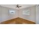 Bright bedroom featuring large windows, hardwood floors, and neutral paint at 5706 10Th Avenue Dr W, Bradenton, FL 34209