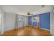 This is a spacious bedroom with two windows, light colored walls, and a ceiling fan at 5706 10Th Avenue Dr W, Bradenton, FL 34209
