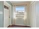 Bright entryway featuring a decorative front door, window with curtains, and closet for storage at 5706 10Th Avenue Dr W, Bradenton, FL 34209