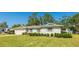 Charming home featuring a well-manicured lawn and a two-car garage, creating great curb appeal at 5706 10Th Avenue Dr W, Bradenton, FL 34209