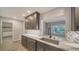 Modern kitchen featuring white marble counters, stylish backsplash, and stainless steel appliances at 5706 10Th Avenue Dr W, Bradenton, FL 34209