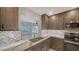 Renovated kitchen featuring stainless steel appliances, modern cabinets, and marble countertops at 5706 10Th Avenue Dr W, Bradenton, FL 34209