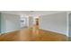 Open-concept living room featuring hardwood floors, lots of natural light, and neutral paint at 5706 10Th Avenue Dr W, Bradenton, FL 34209