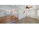 Open-concept living room with light hardwood floors, and view to dining and additional rooms at 5706 10Th Avenue Dr W, Bradenton, FL 34209