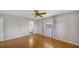 Large main bedroom featuring hardwood floors, a ceiling fan, and an en-suite bath at 5706 10Th Avenue Dr W, Bradenton, FL 34209