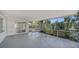 Expansive screened patio offering serene outdoor living with lush landscaping and natural light at 5706 10Th Avenue Dr W, Bradenton, FL 34209