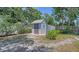 Backyard shed offering additional storage space, with maintained surrounding landscape at 5706 10Th Avenue Dr W, Bradenton, FL 34209