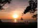 Sailboat cruises on the tranquil waters while catching the beautiful sunset at 5706 10Th Avenue Dr W, Bradenton, FL 34209