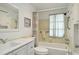 Bathroom featuring tiled walls, white vanity, and a shower-tub combination at 577 Circlewood Dr # X7, Venice, FL 34293