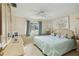 Comfortable bedroom featuring a ceiling fan and neutral tones at 577 Circlewood Dr # X7, Venice, FL 34293