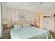 Comfortable bedroom featuring a ceiling fan and neutral tones at 577 Circlewood Dr # X7, Venice, FL 34293