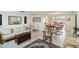 Spacious living room with a view into the dining area, marble floors, and a decorative trunk at 577 Circlewood Dr # X7, Venice, FL 34293