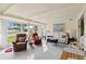 Bright living room filled with neutral furniture and a large picture window at 577 Circlewood Dr # X7, Venice, FL 34293