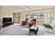 Bright living room filled with neutral furniture and a large picture window at 577 Circlewood Dr # X7, Venice, FL 34293