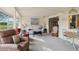Bright living room filled with neutral furniture and a large picture window at 577 Circlewood Dr # X7, Venice, FL 34293
