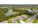 Aerial view of community pond surrounded by beautiful landscaping and well-maintained single-Gathering homes at 5904 114Th E Dr, Parrish, FL 34219