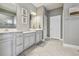 This bathroom features double sinks, bright lighting, and stylish neutral tones at 5904 114Th E Dr, Parrish, FL 34219