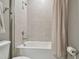Cozy bathroom featuring neutral colors, framed mirror, bathtub and shower combination and gray tile at 5904 114Th E Dr, Parrish, FL 34219