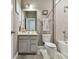 Cozy bathroom with a single vanity, white cabinets, framed mirror, bathtub and shower combination and gray tile at 5904 114Th E Dr, Parrish, FL 34219