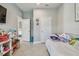 bedroom offering neutral paint, two closets, tile flooring, and a lot of toys at 5904 114Th E Dr, Parrish, FL 34219