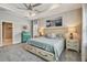 Comfortable bedroom features a tray ceiling, stylish decor, and plush carpeting at 5904 114Th E Dr, Parrish, FL 34219