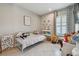 bedroom offering neutral paint, light from the window, tile flooring, and a lot of toys at 5904 114Th E Dr, Parrish, FL 34219