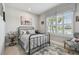 Charming bedroom featuring natural light, tile floors, and neutral colors perfect for relaxing and sleeping at 5904 114Th E Dr, Parrish, FL 34219