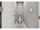 This half bathroom features a toilet, vanity and towel rack at 5904 114Th E Dr, Parrish, FL 34219